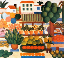 Pintura colorida com diversos elementos. Em primeiro plano, há variadas frutas consumidas no Brasil: caju, banana, manga, abacaxi, laranja. Em segundo plano, há uma árvore, alguns vasos de plantas e, próximos a eles, alguns animais: um coelho branco, um tatu e um pássaro marrom. Em terceiro plano, há três casas e três palmeiras.