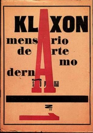 Capa da revista Klaxon nas cores vermelho, preto e branco. O &quot;A&quot; de Klaxon ocupa a parte central da capa em cor vermelha  e ocupa o espaço de &quot;A&quot; nos subtítulos &quot;Mensário de Arte Moderna, São Paulo&quot;. Na parte inferior um número 1 deitado em cor vermelha indica o número da edição. Bordas pretas cercam a capa.